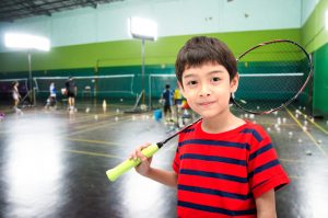 boy with a racket ready to learn and play