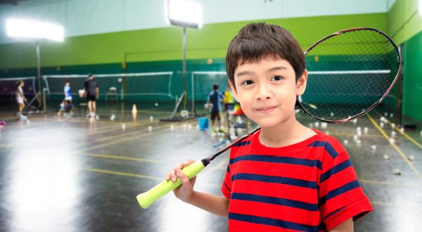 boy with a racket ready to learn and play